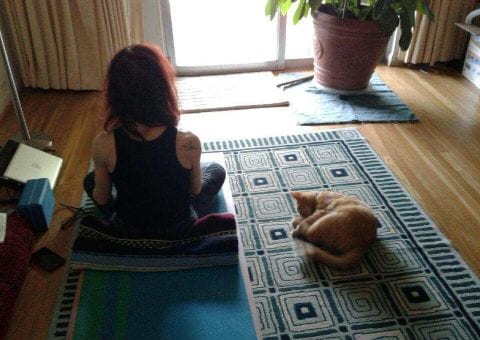 Claudia Neuman on a yoga mat