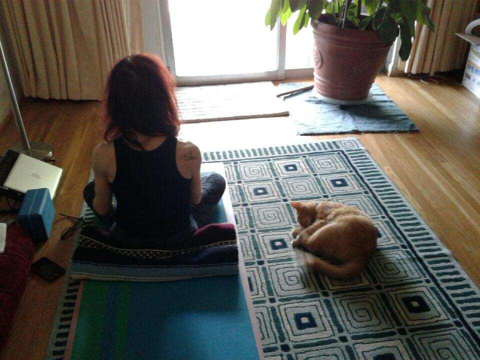 Claudia Neuman on a yoga mat